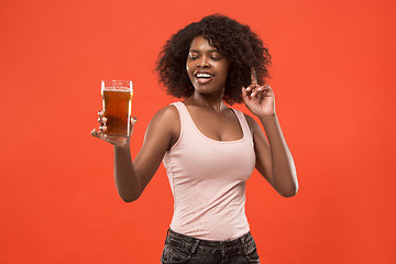 Image showing Sexy young afro woman drinking beer, not isolated on white background