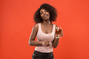 Image showing Sexy young afro woman drinking beer, not isolated on white background