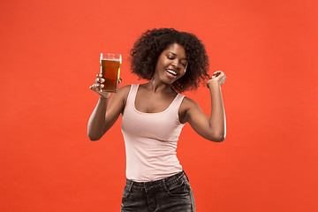 Image showing Sexy young afro woman drinking beer, not isolated on white background