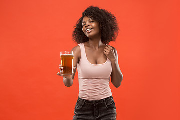 Image showing Sexy young afro woman drinking beer, not isolated on white background