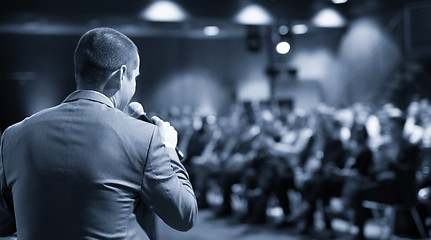 Image showing Public speaker giving talk at business event.