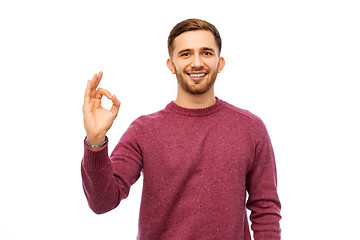 Image showing smiling young man over white background