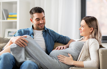 Image showing happy man with pregnant woman at home