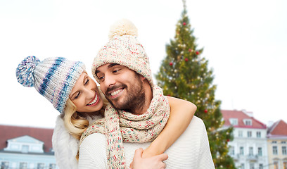 Image showing happy couple hugging over christmas tree