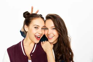 Image showing happy smiling teenage girls over white background