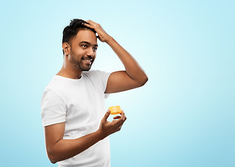 Image showing indian man applying hair wax or styling gel