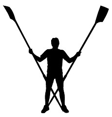 Image showing Male rower standing with crossed rowing oars