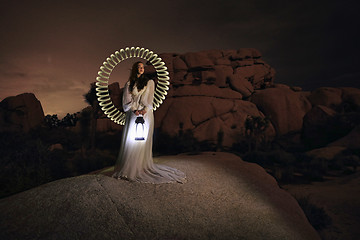 Image showing Person Light Painted in the Desert Under the Night Sky