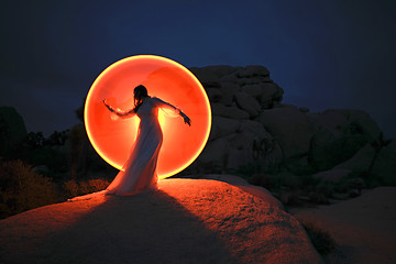 Image showing Person Light Painted in the Desert Under the Night Sky