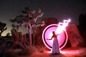 Image showing Person Light Painted in the Desert Under the Night Sky