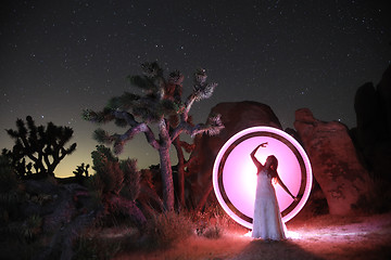 Image showing Person Light Painted in the Desert Under the Night Sky