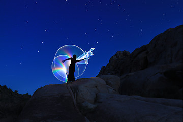 Image showing Person Light Painted in the Desert Under the Night Sky