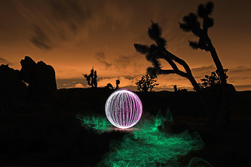 Image showing Person Light Painted in the Desert Under the Night Sky