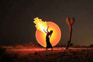 Image showing Person Light Painted in the Desert Under the Night Sky