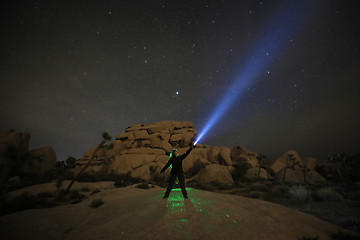 Image showing Person Light Painted in the Desert Under the Night Sky