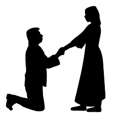 Image showing Man on knees holding hands of woman and asking her to marry