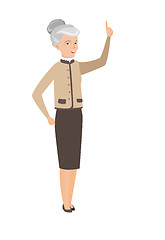 Image showing Caucasian business woman pointing forefinger up.