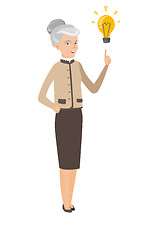 Image showing Caucasian business woman pointing at idea bulb.