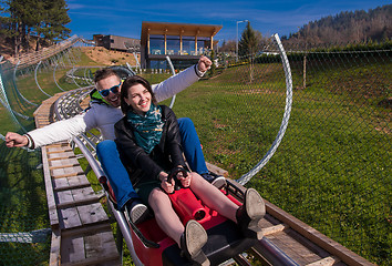 Image showing couple driving on alpine coaster