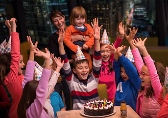 Image showing happy young boy having birthday party