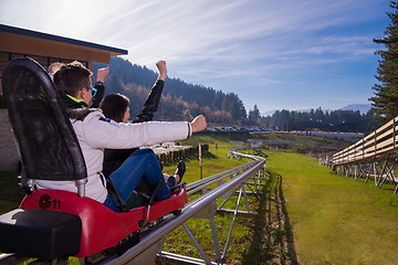 Image showing couple driving on alpine coaster