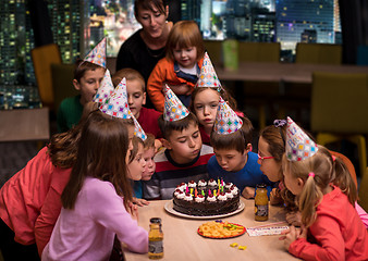 Image showing happy young boy having birthday party