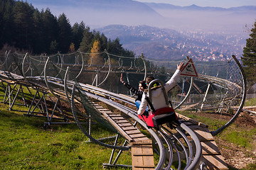 Image showing couple driving on alpine coaster