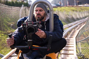 Image showing videographer at work on alpine coaster