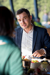 Image showing youn couple enjoying lunch at restaurant