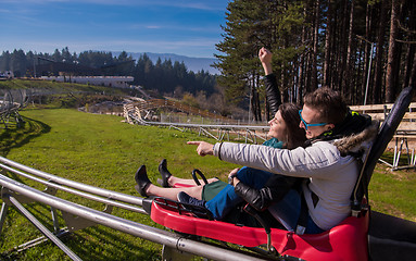 Image showing couple driving on alpine coaster