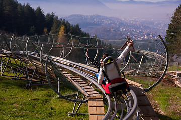 Image showing couple driving on alpine coaster