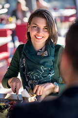 Image showing youn couple enjoying lunch at restaurant