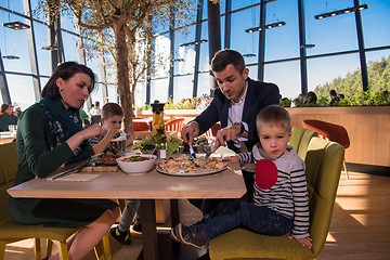 Image showing happy family enjoying lunch time together