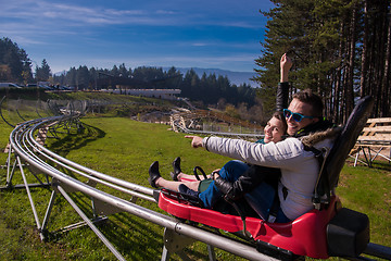 Image showing couple driving on alpine coaster