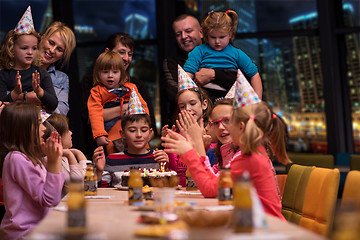 Image showing happy young boy having birthday party