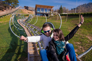 Image showing couple driving on alpine coaster