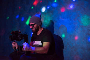 Image showing videographer in neon disco party