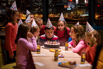 Image showing happy young boy having birthday party