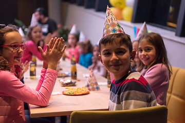 Image showing The young boy joyfully celebrating his birthday