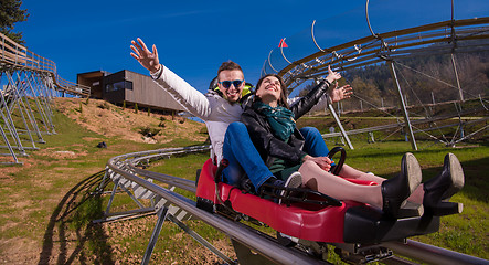 Image showing couple driving on alpine coaster