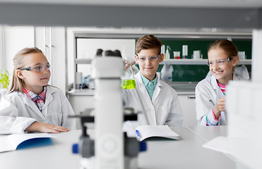 Image showing kids with test tubes studying chemistry at school