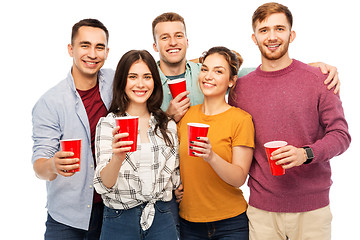 Image showing group of smiling friends with drinks in party cups