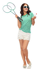 Image showing teen girl with badminton rackets and shuttlecock