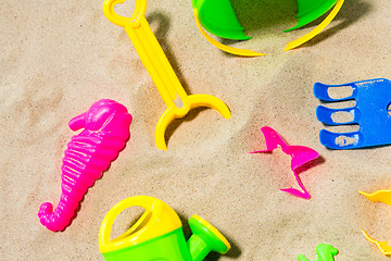 Image showing close up of sand toys kit on summer beach