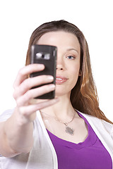 Image showing Woman taking  pictures from her cell phone