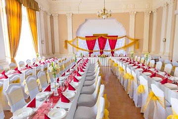 Image showing Large dining hall with tables set up