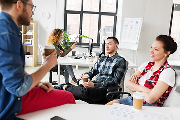 Image showing creative team drinking coffee at office