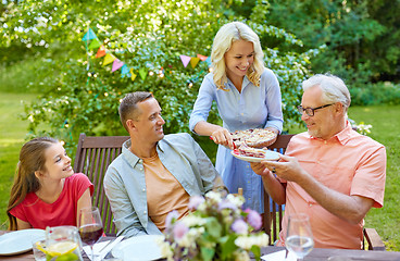 Image showing happy family having dinner or summer garden party