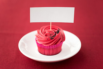 Image showing close up of cupcake with red buttercream frosting