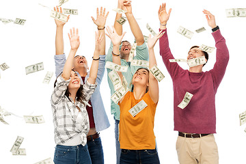 Image showing happy friends picking money falling from up above